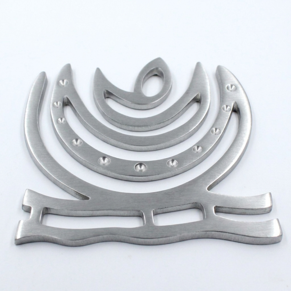 zinc-chand-helix-vastu-remedy-northeast.jpg Close-up of zinc helix Vastu remedy showing metallic finish and crescent shape